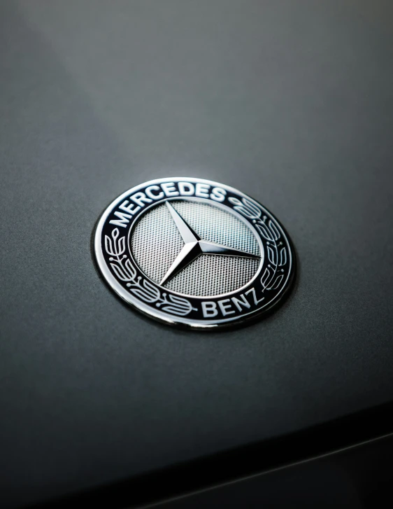 a mercedes benz badge is shown on a car