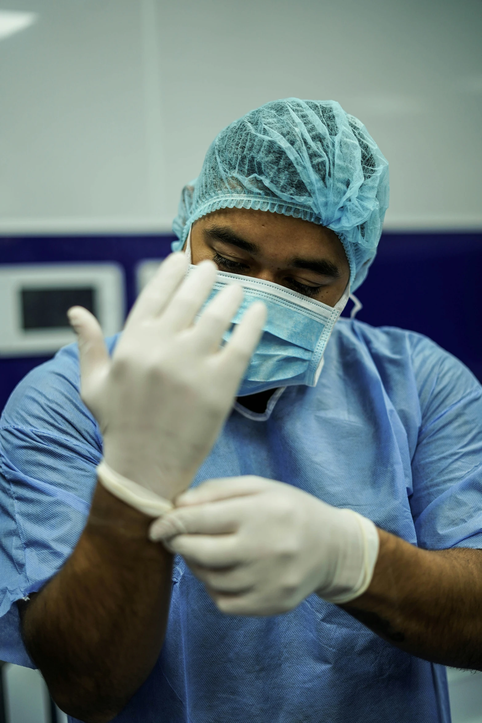 a surgeon wearing protective gear on top of his arms