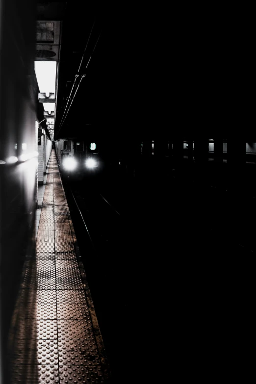 a hallway in the middle of a building with lights