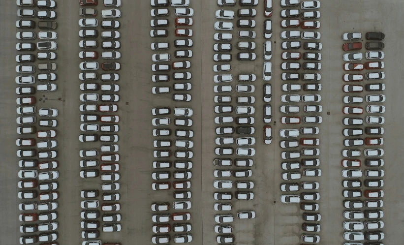 a large parking lot with some cars parked in it