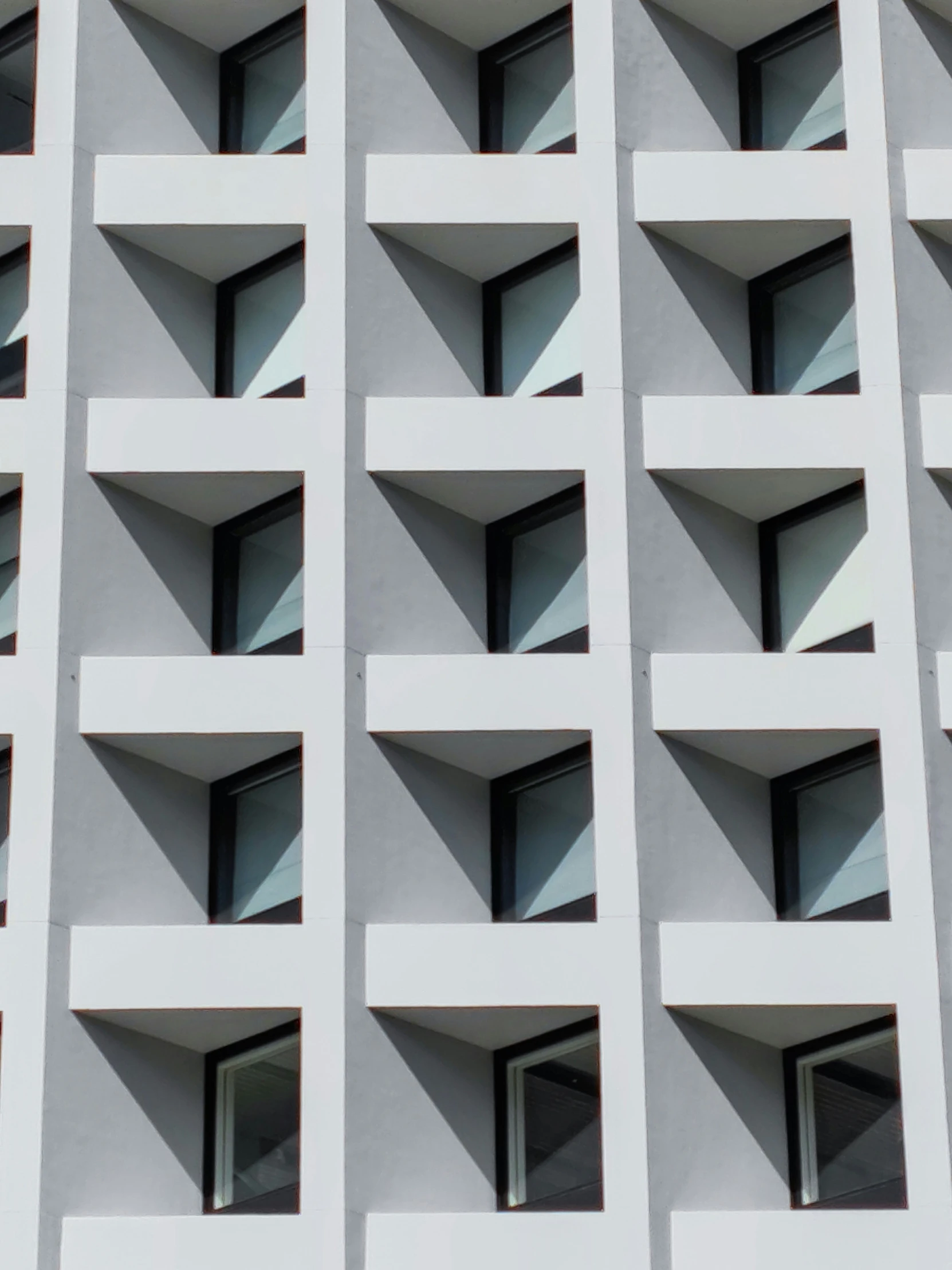 large white and gray building with several windows