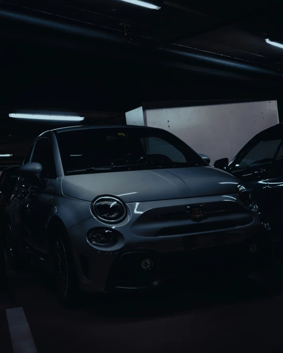 a row of parked cars sitting in a garage