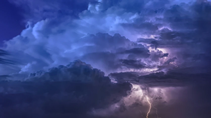 storm clouds with lightning bolt striking against them