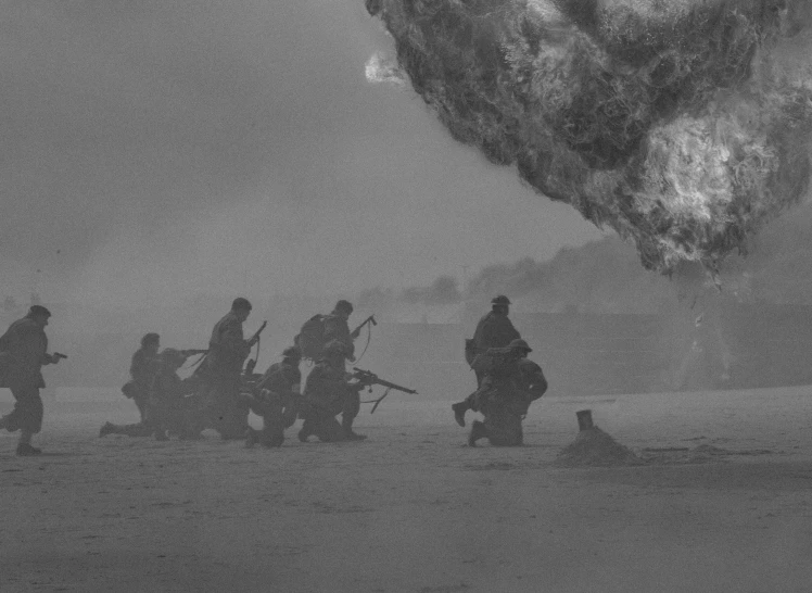 a group of people standing under a very big black fire