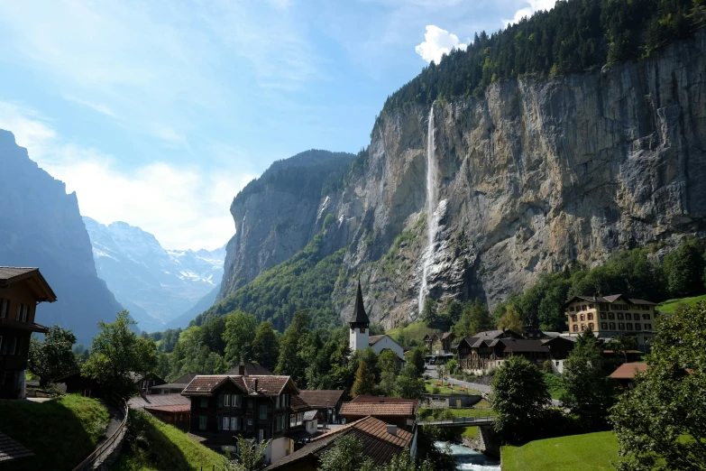 the village and waterfalls are built in the mountains