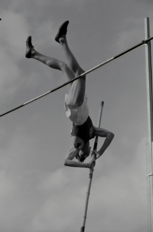 a man is high in the air on his pole