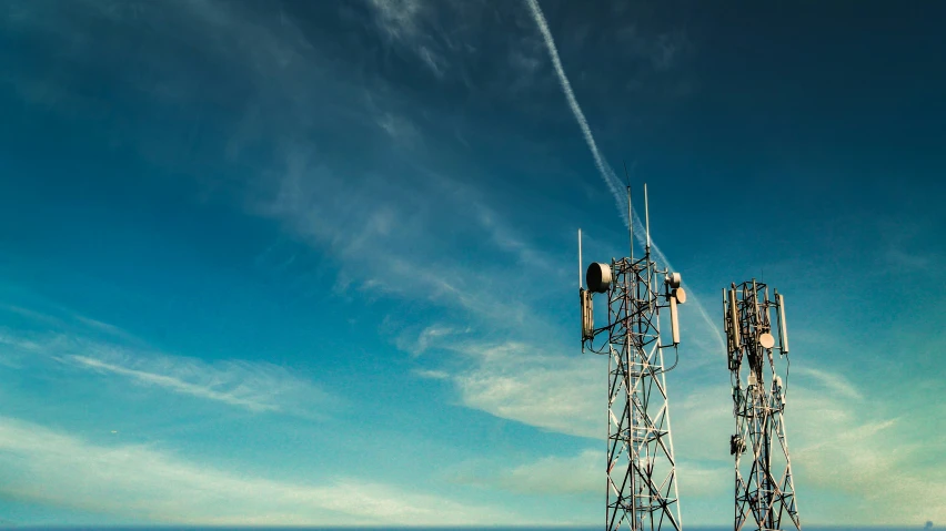 the very tall towers are against the clear blue sky