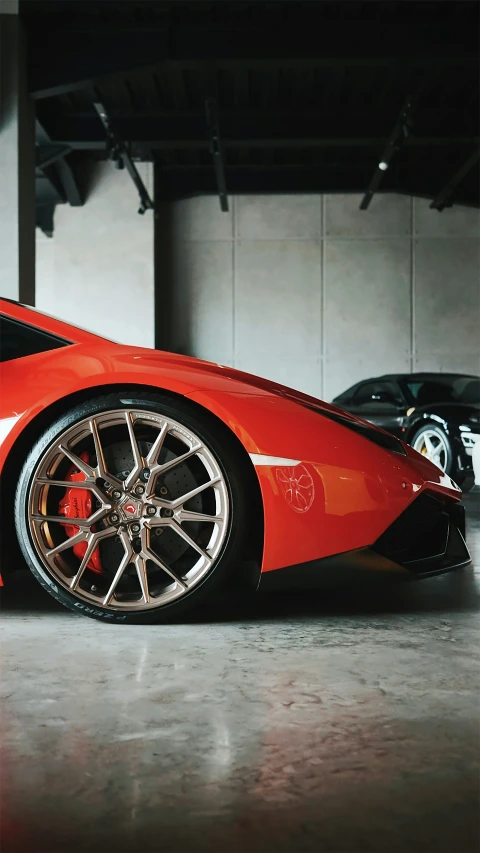 a red sports car parked in a garage