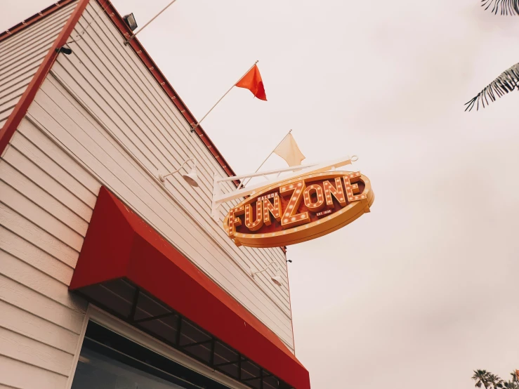 the sign for an american fast food restaurant hangs over the corner