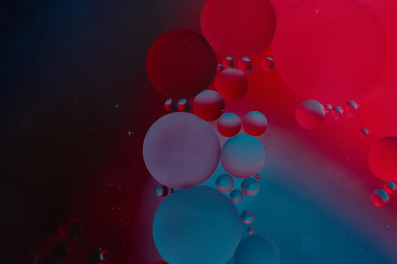 colorful circles and bubbles are in the water