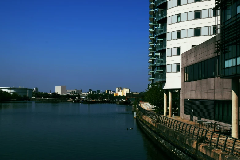 a tall building next to a body of water