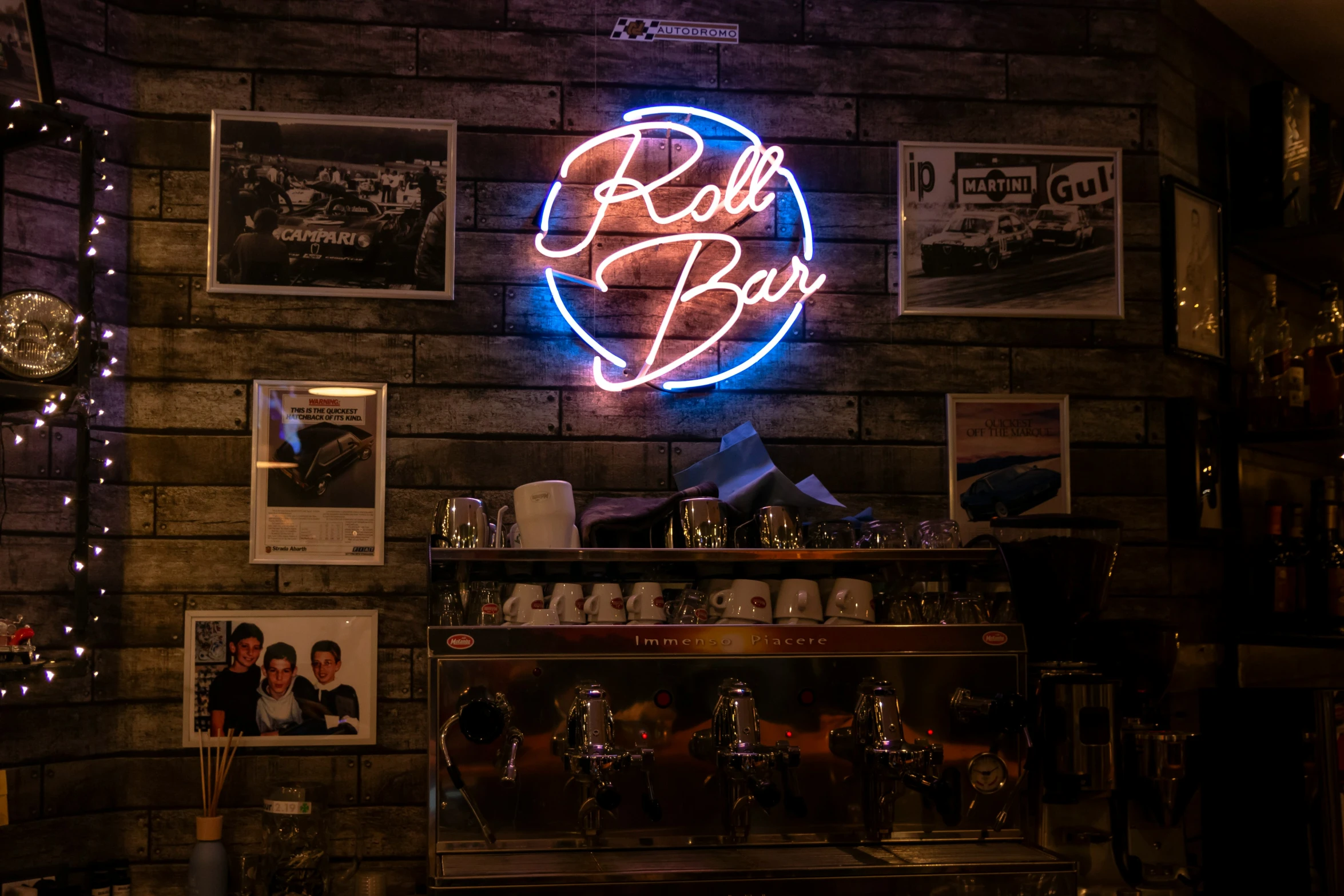 neon sign above bar that sells beer and food