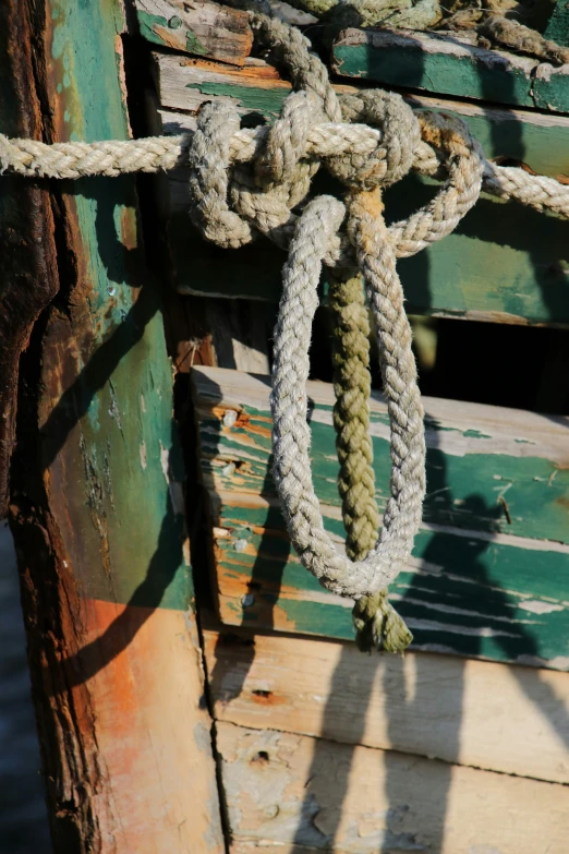 ropes of an old sailing vessel that is tied up