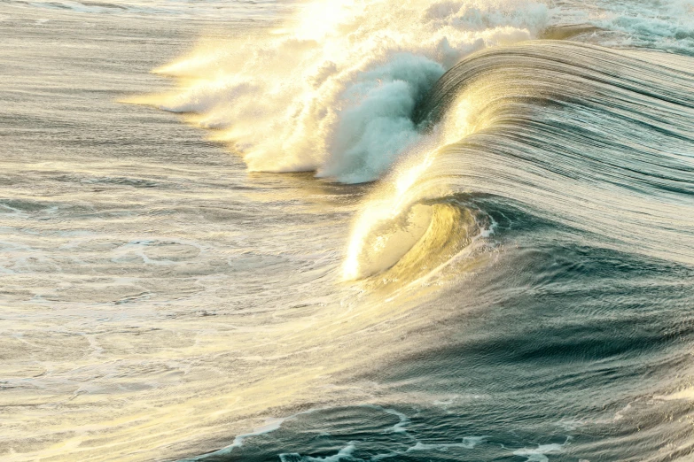 the water sprays in front of the wave