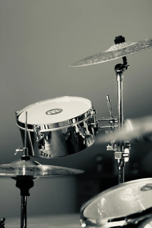 a drum set is sitting in a black and white po