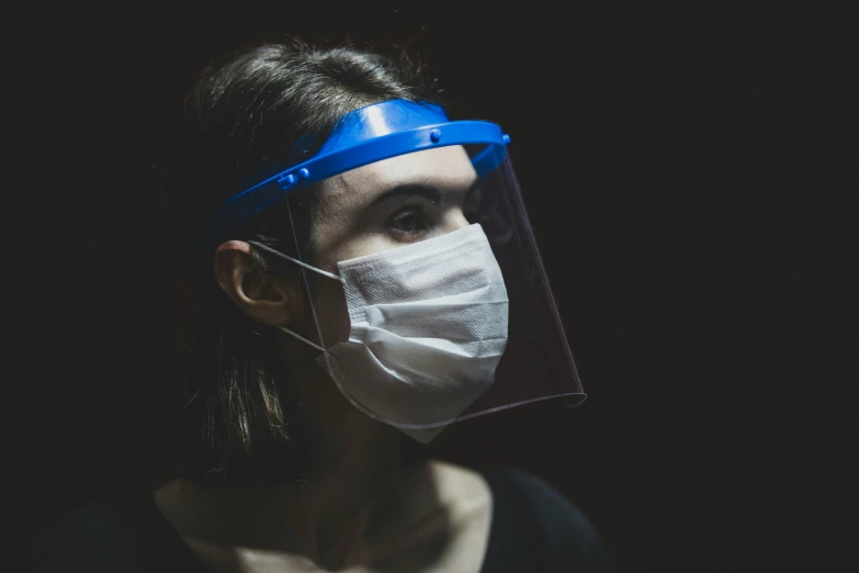 a woman with glasses, wearing a face mask