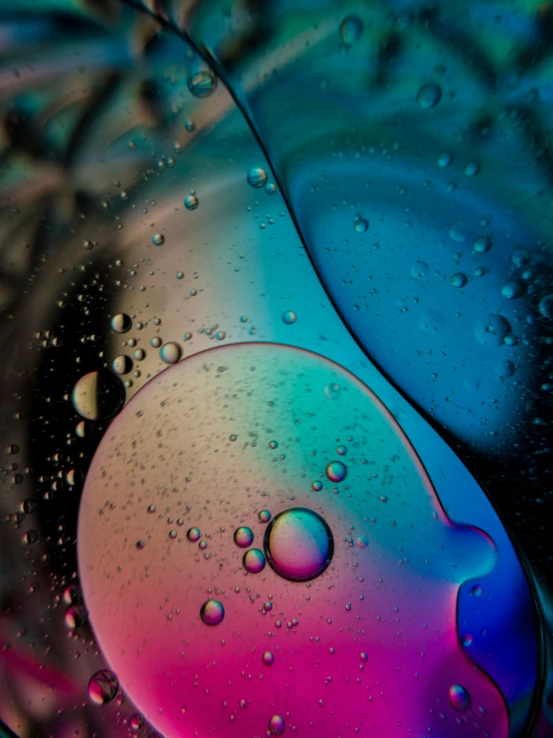 a po of some sort of art in multi - colored liquid