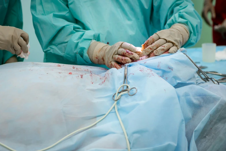 a person operating on a medical device in the hospital