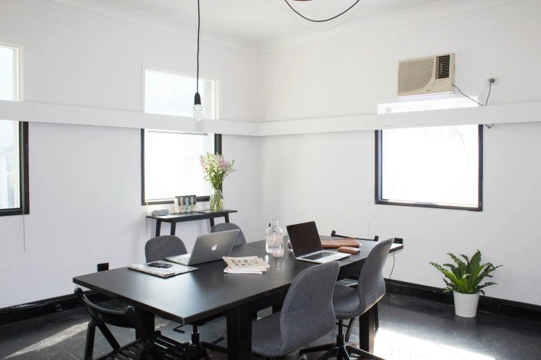 a room that has two laptop computers on the table