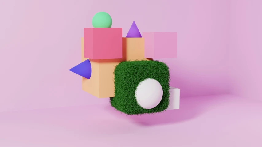 a green, white and pink object on top of some grass