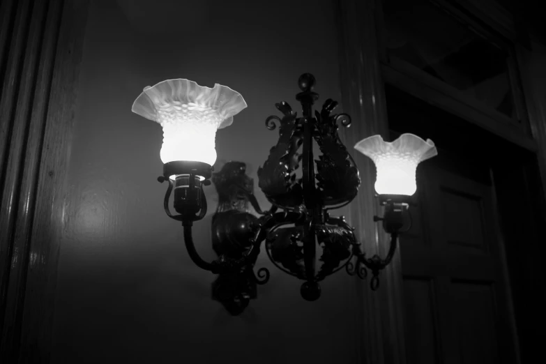 two light fixtures, one white and the other black