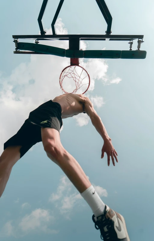 a man with  standing on a basketball court