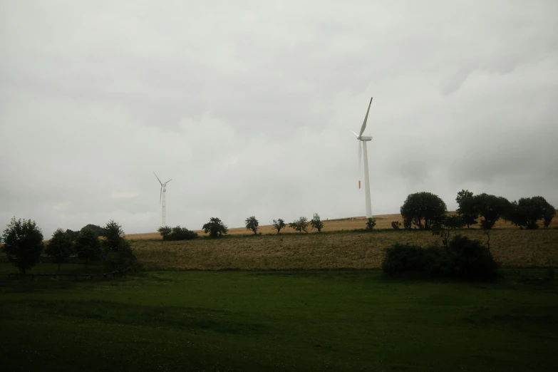 the wind farm is at the top of the hill