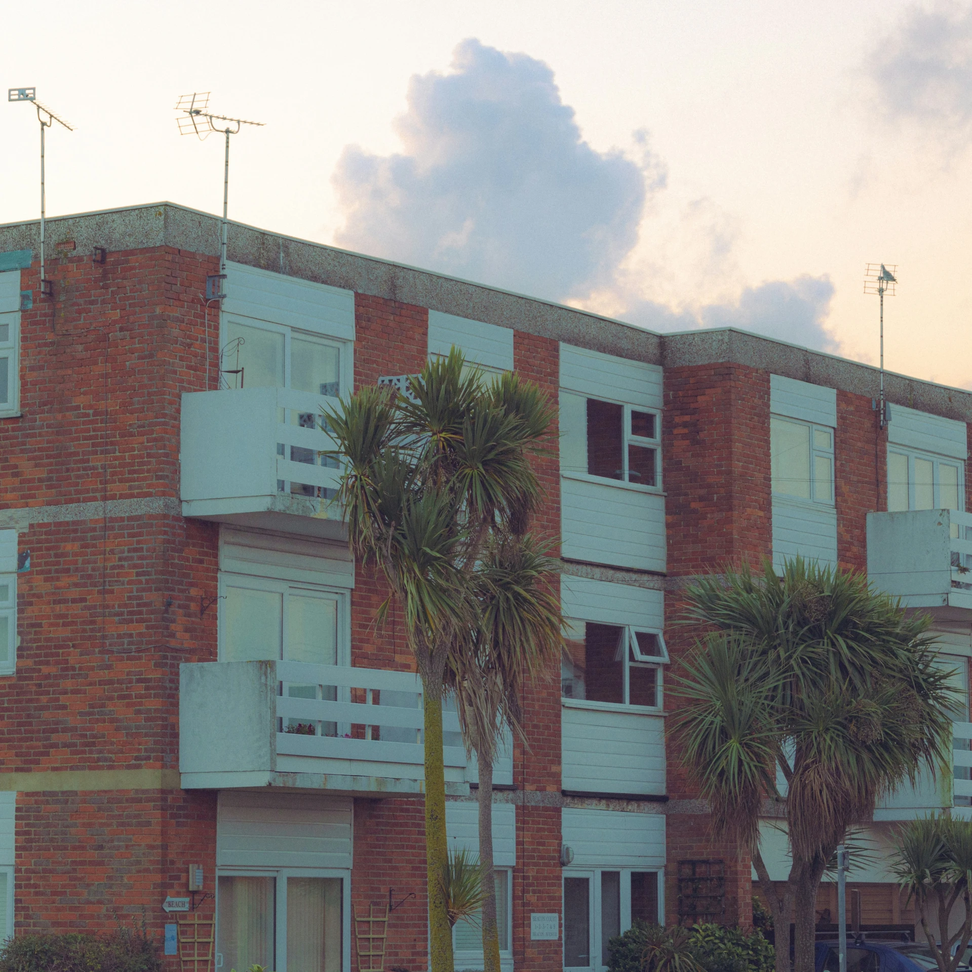 a tall brick building with a clock tower on top