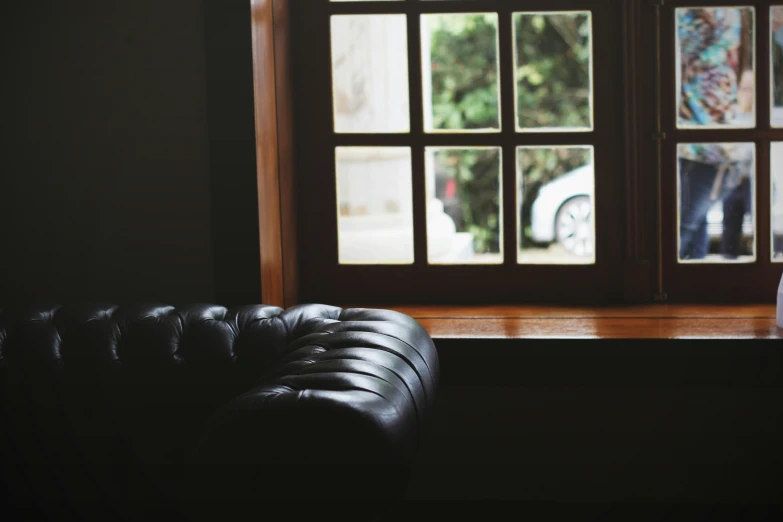 the couch in front of a large window