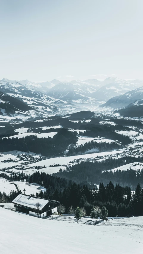 a small house on the snowy mountains by itself