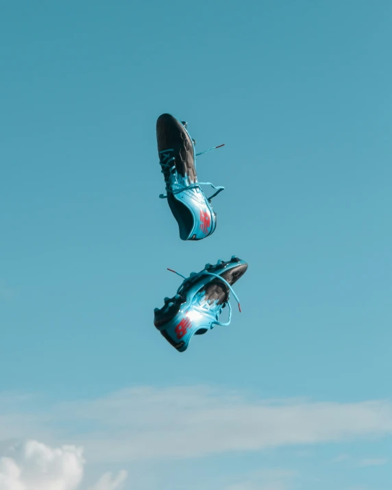 two pairs of sneakers floating on the water