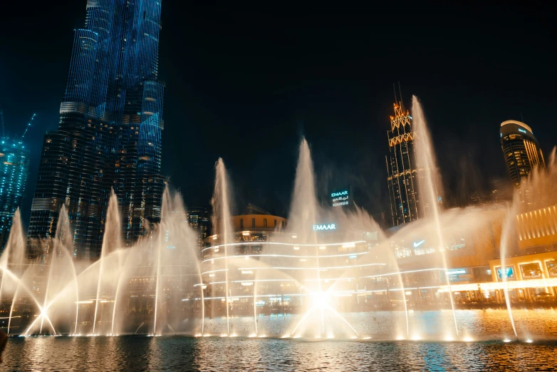 a wide view of the fountain show on a dark night