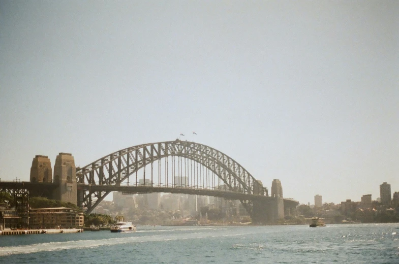 view of harbour with boats on water and sydney city in background