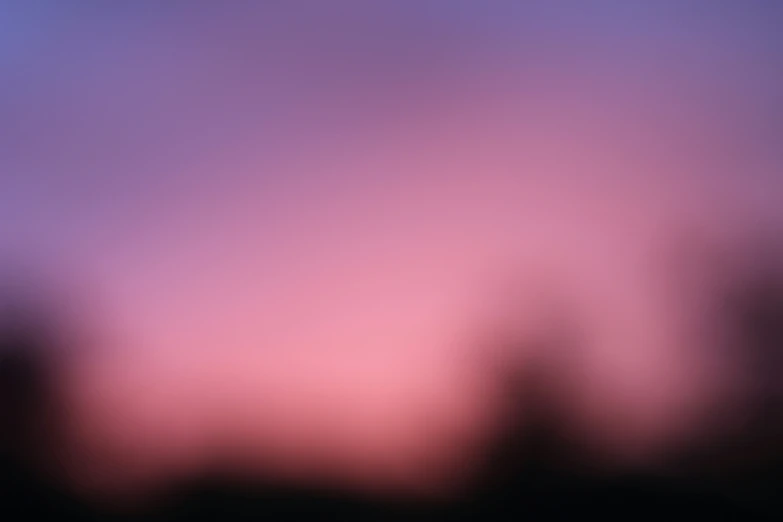 the blurry image is of the sky and trees