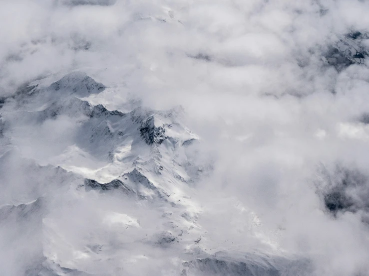 a view from the air, looking down at an extremely tall mountain