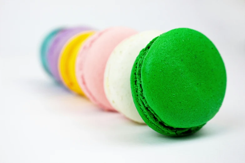 colorful round cookies on white surface with white background