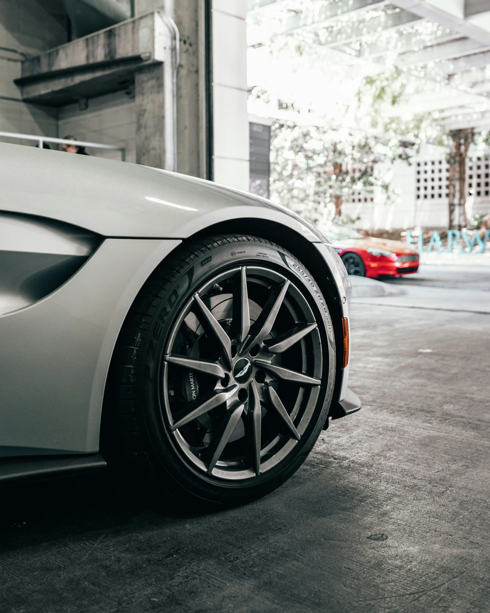 the front wheel view on a silver sports car