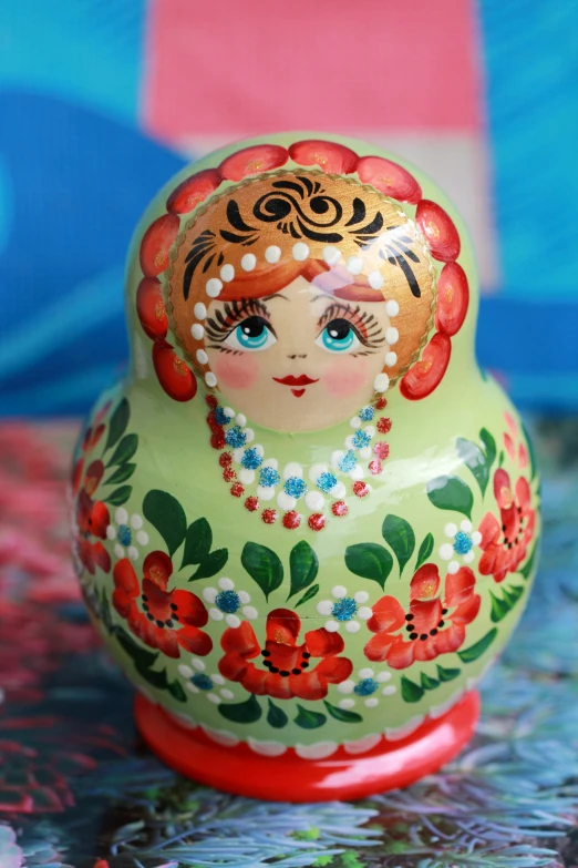 small traditional russian wooden doll, featuring floral design