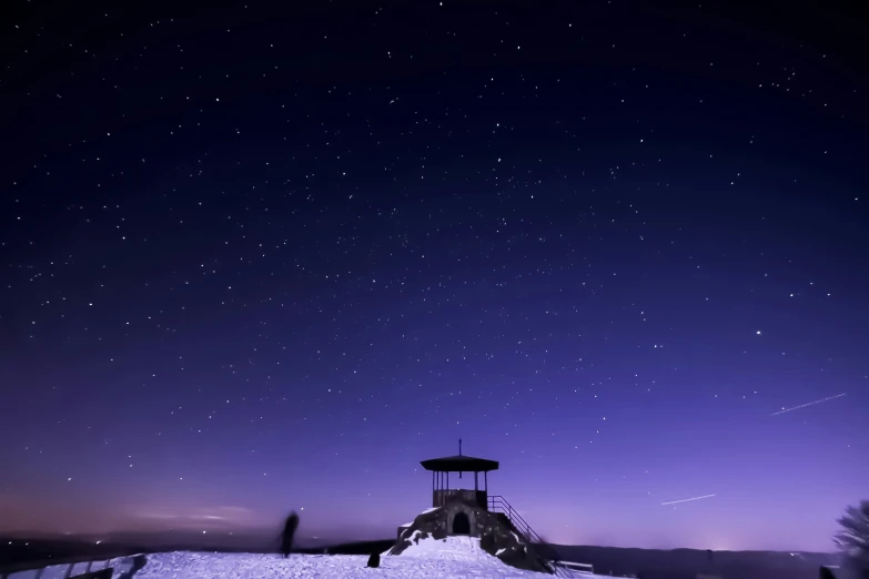 a night sky with the moon and stars shining