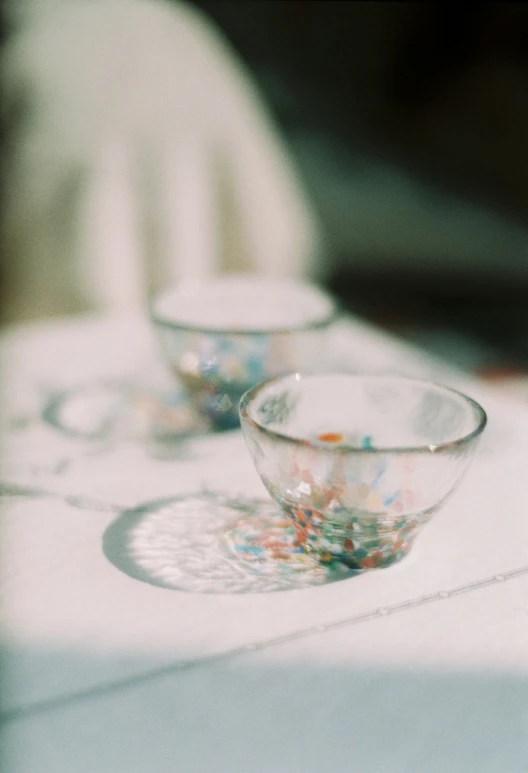 the bowls are sitting on the dining room table