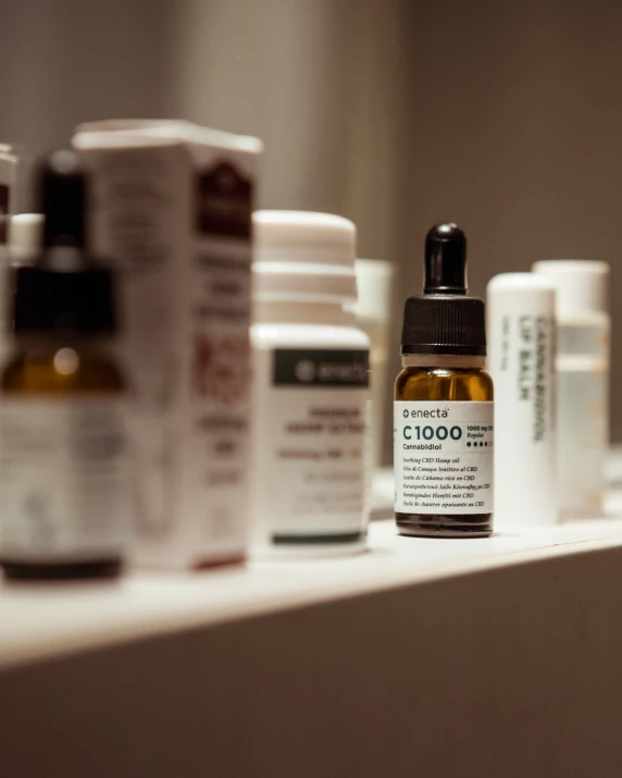 bottles of prescription products on a shelf in a room