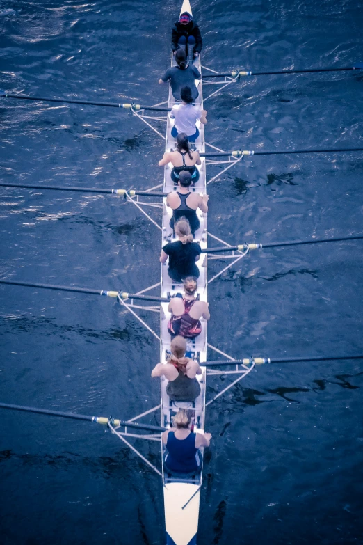 a group of people who are rowing on water