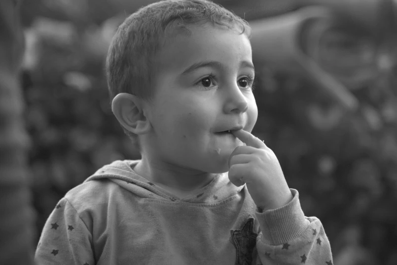 a  is brushing his teeth with his hand