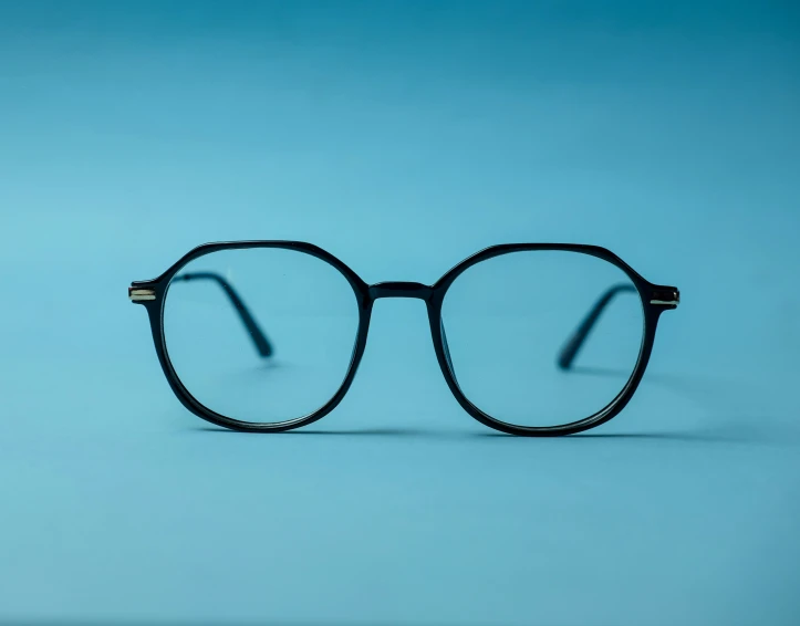 a pair of glasses is shown on a blue background