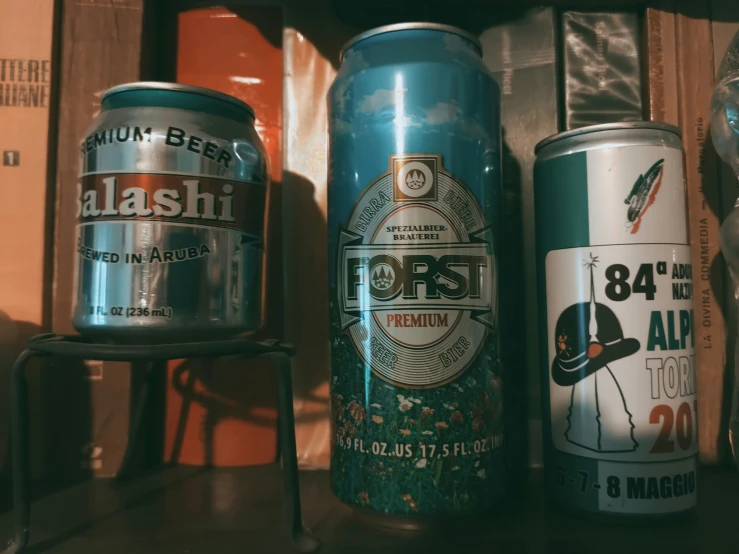 some old cans are sitting on a shelf