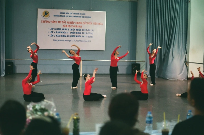 a group of people that are standing in the middle of the room