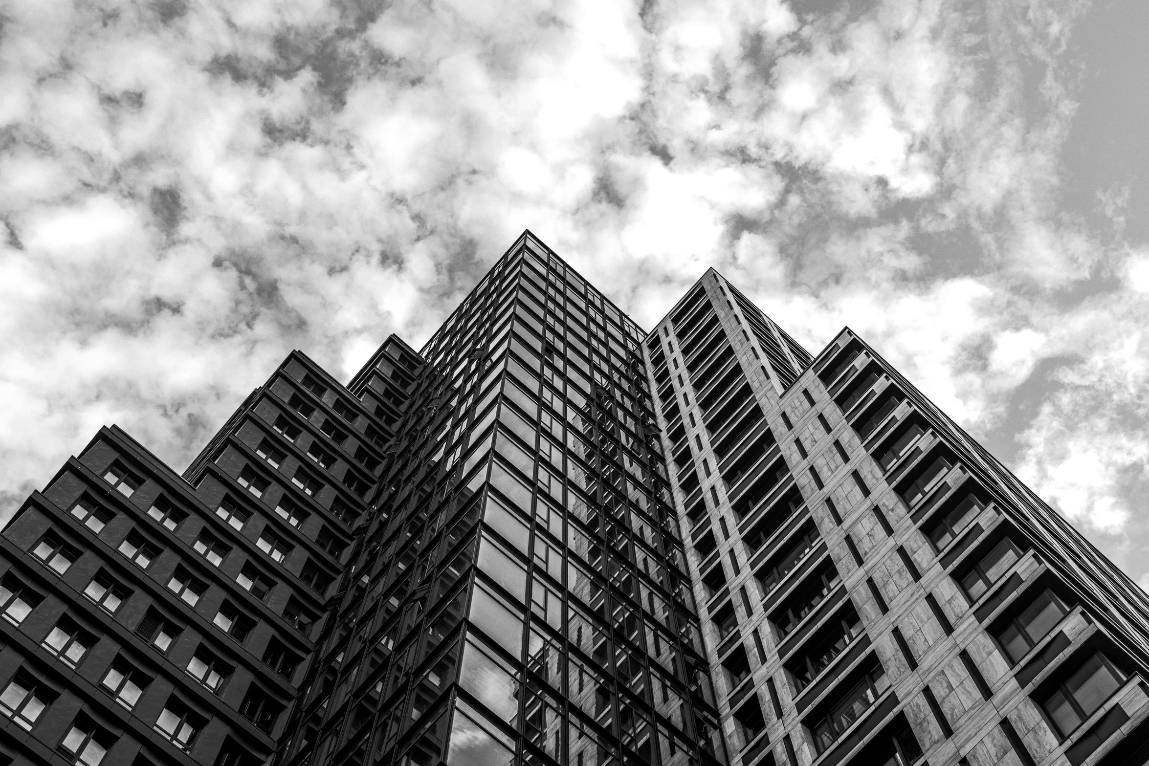 this is an image of two tall buildings in black and white