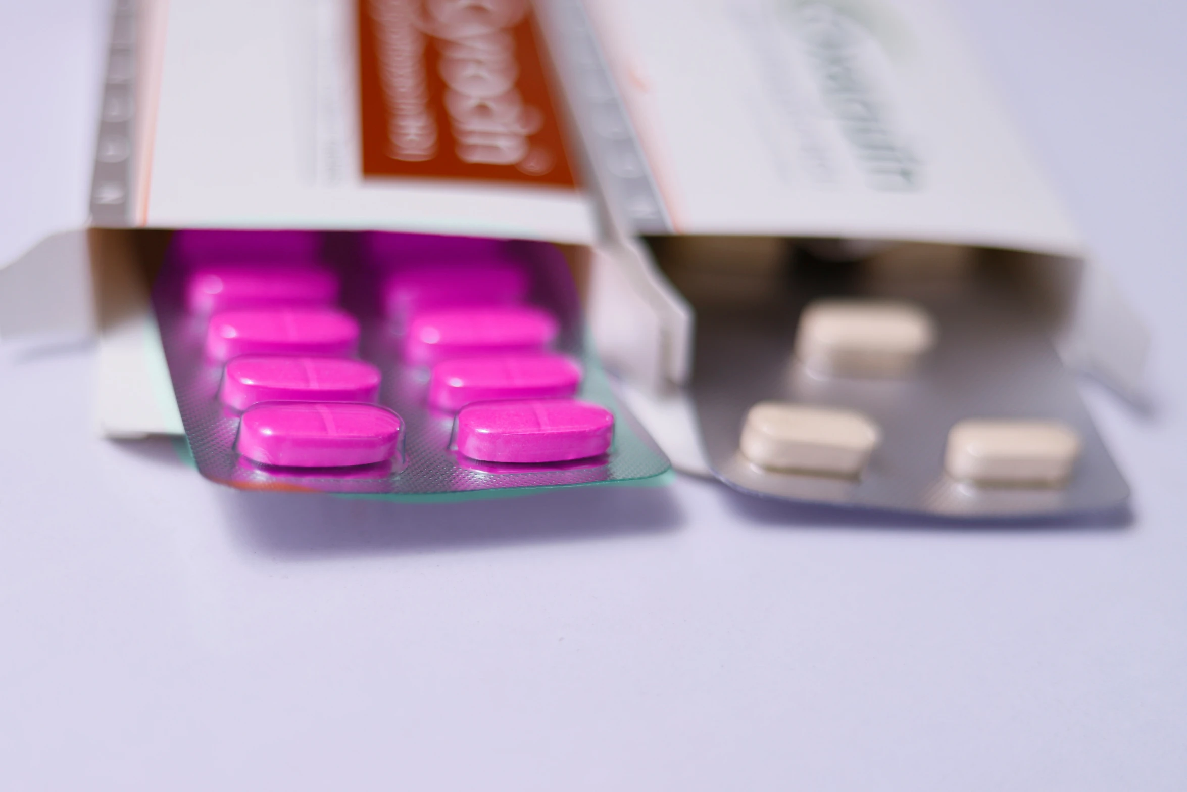 a pink pills pill with three contraptions attached