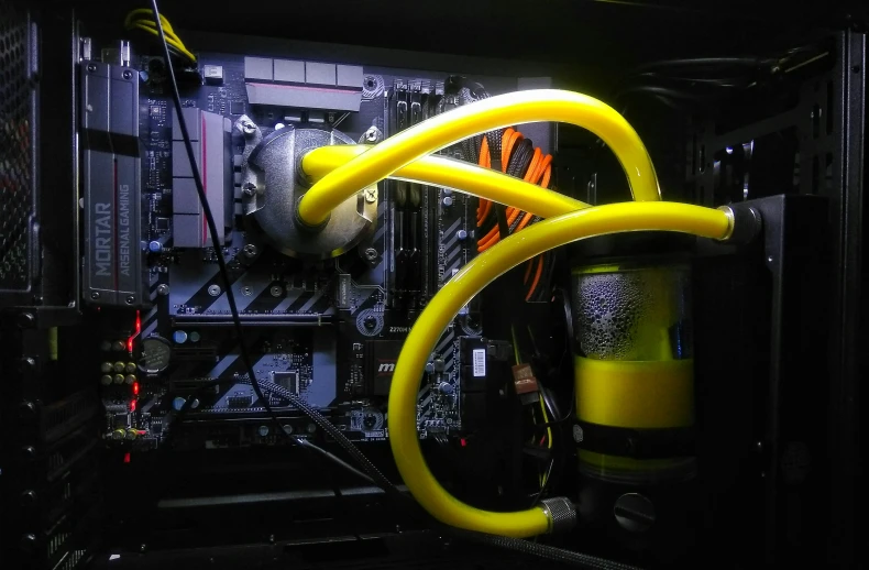 the inside of a computer with multiple yellow wires