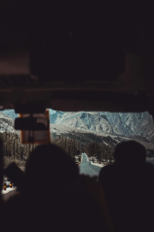 view from the cabin window of a bus as it passes